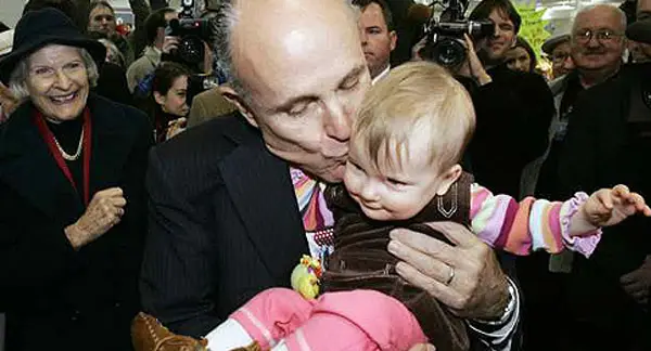 Politician kissing a baby